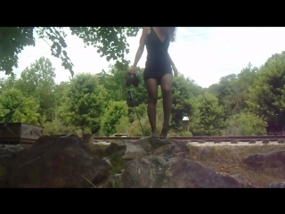 jess walking on rocks in pantyhose and dress